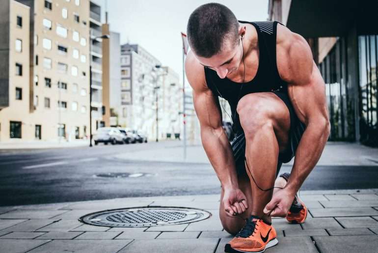 man tying his shoes