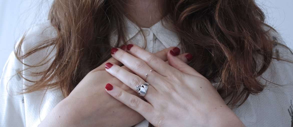 woman wearing silver-colored ring