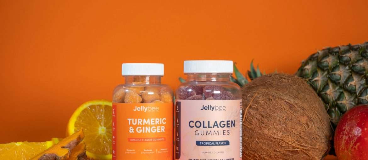 3 glass bottles on brown wooden table